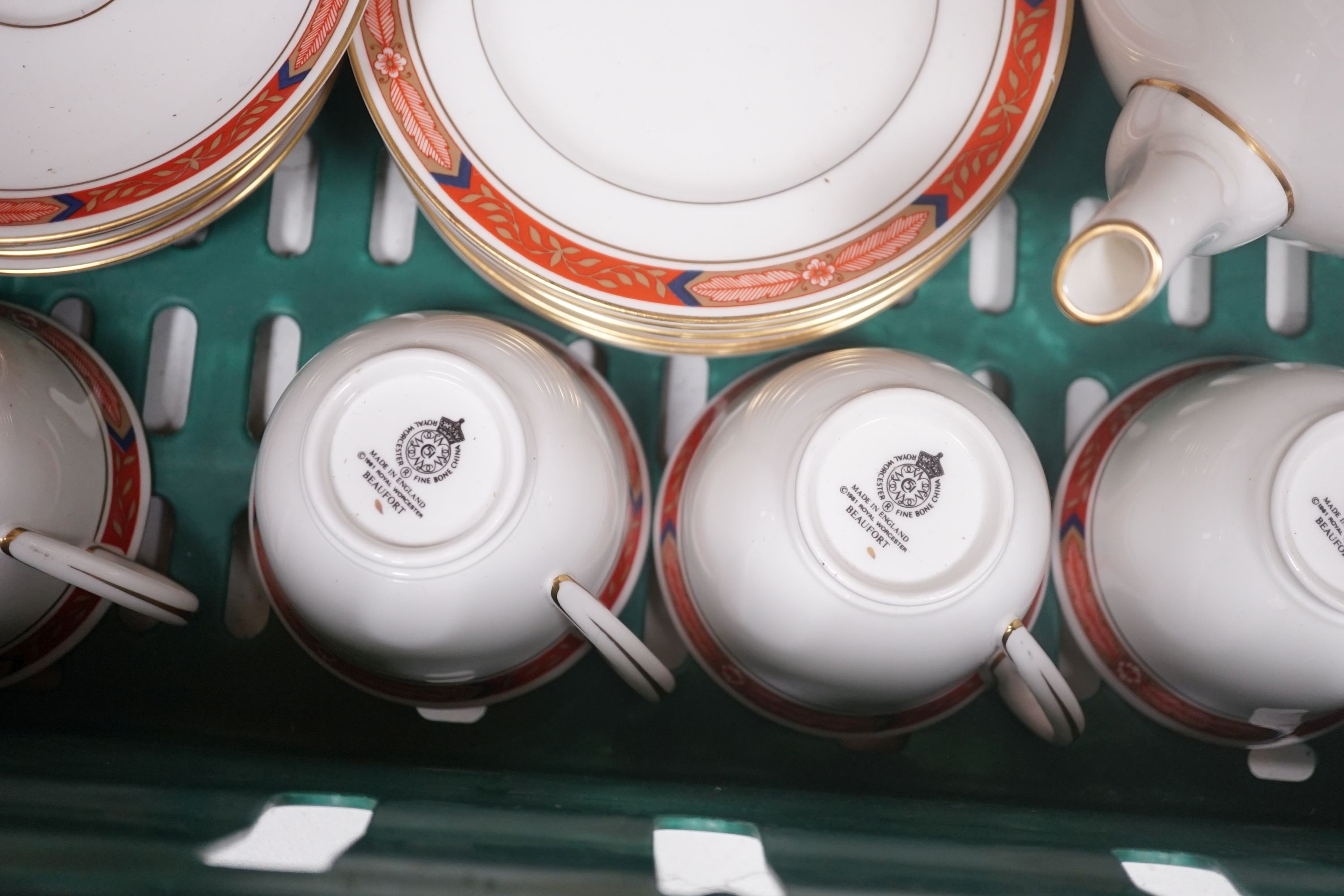 A Royal Worcester 'Beaufort' red tea service for eight